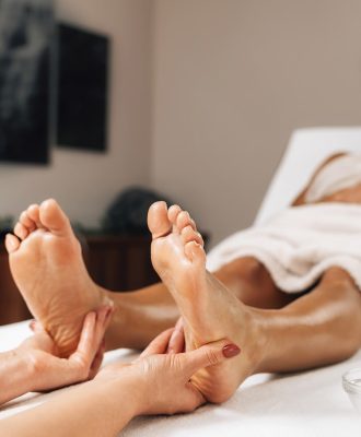 enjoying-foot-massage-treatment-in-a-wellness-cent-2023-11-27-05-06-23-utc.jpg